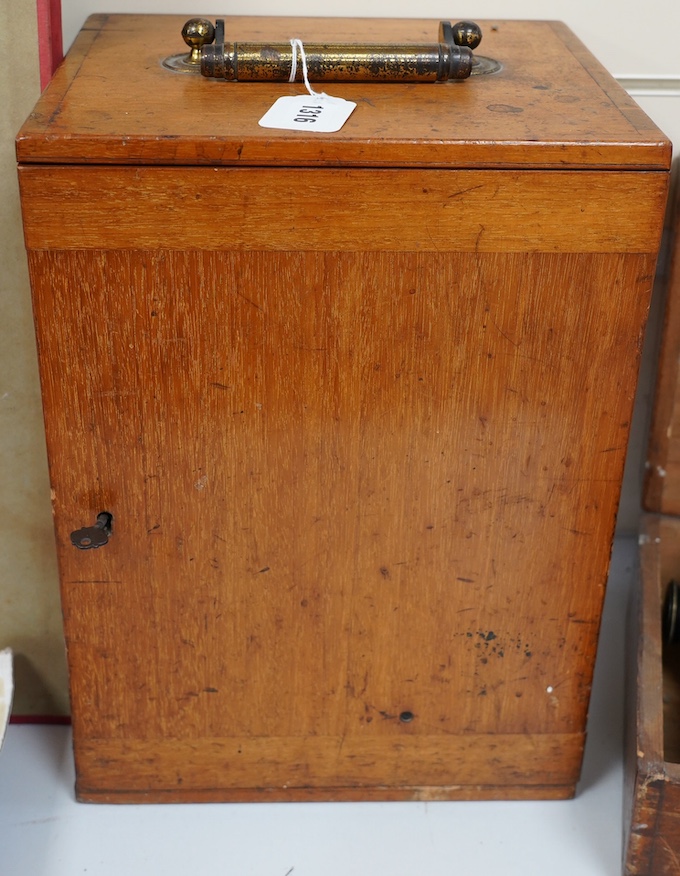 A late 19th/early 20th century brass microscope, by Watson and Sons, in a fitted case with some alternative lenses and other accessories, case 39.5cm high. Condition - fair